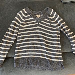 Grey and white striped women’s sweater.
